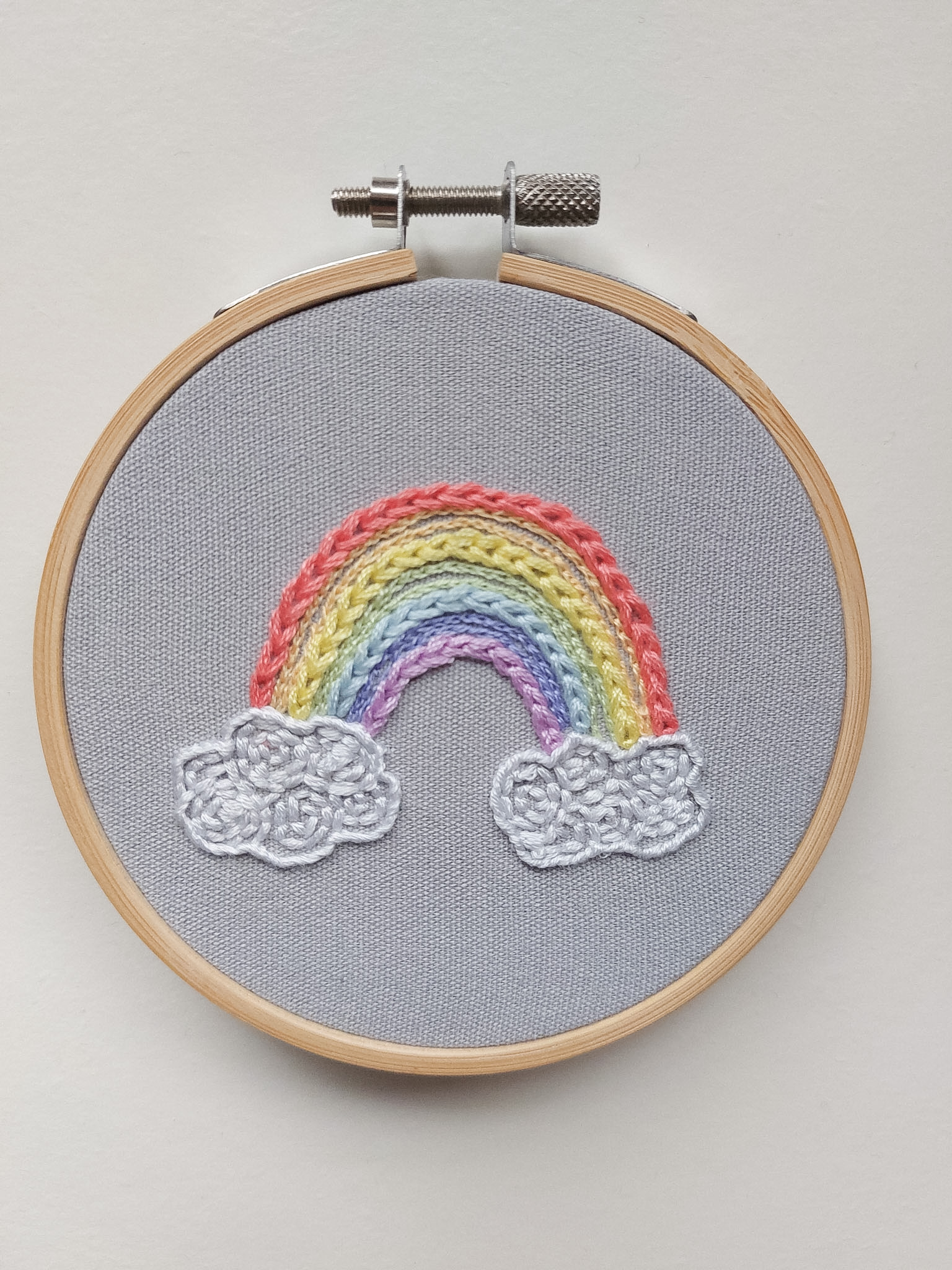 Angela's Finished Rainbow embroidery hoop, created from an Outline Challenge inside the Bloom Embroidery Membership